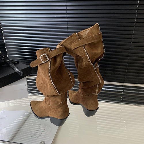 Two brown suede slouchy high boots with block heels, back zippers, and buckled straps.